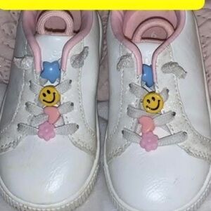 White and Pink Sneakers with Playful Charms